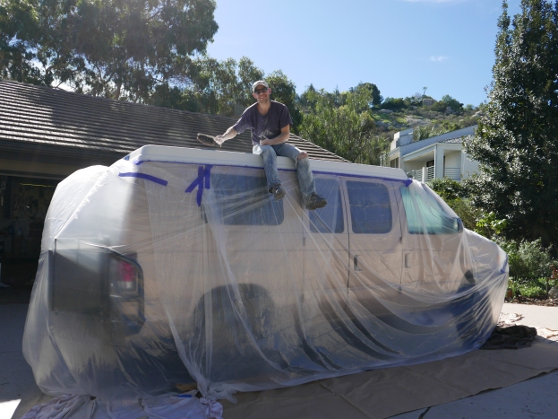 Painting the pop-top with Raptor liner